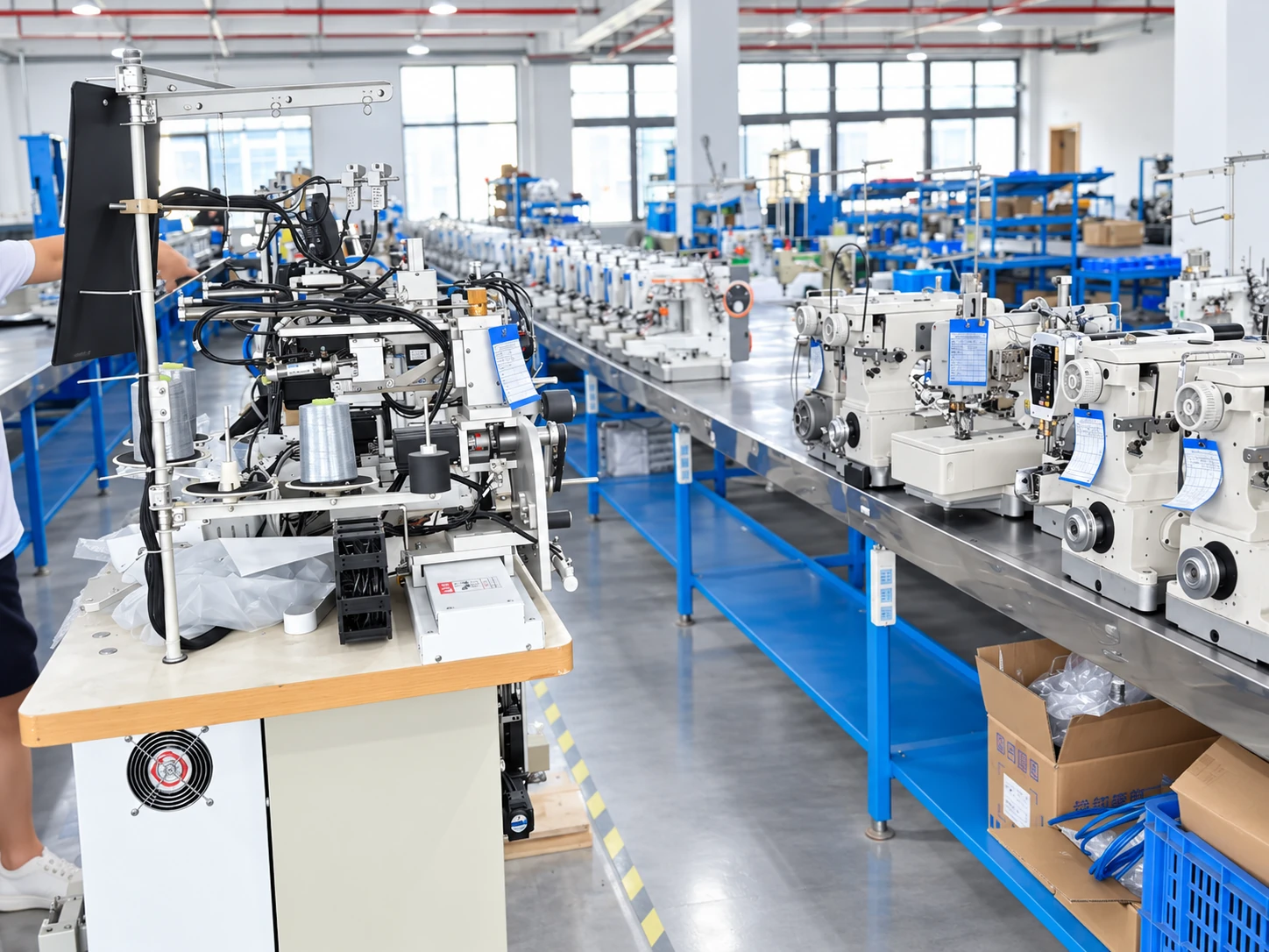Close view of sewing equipment, wiring and workbench components